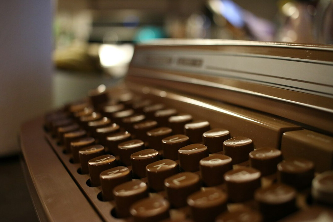 writer typing on typewriter