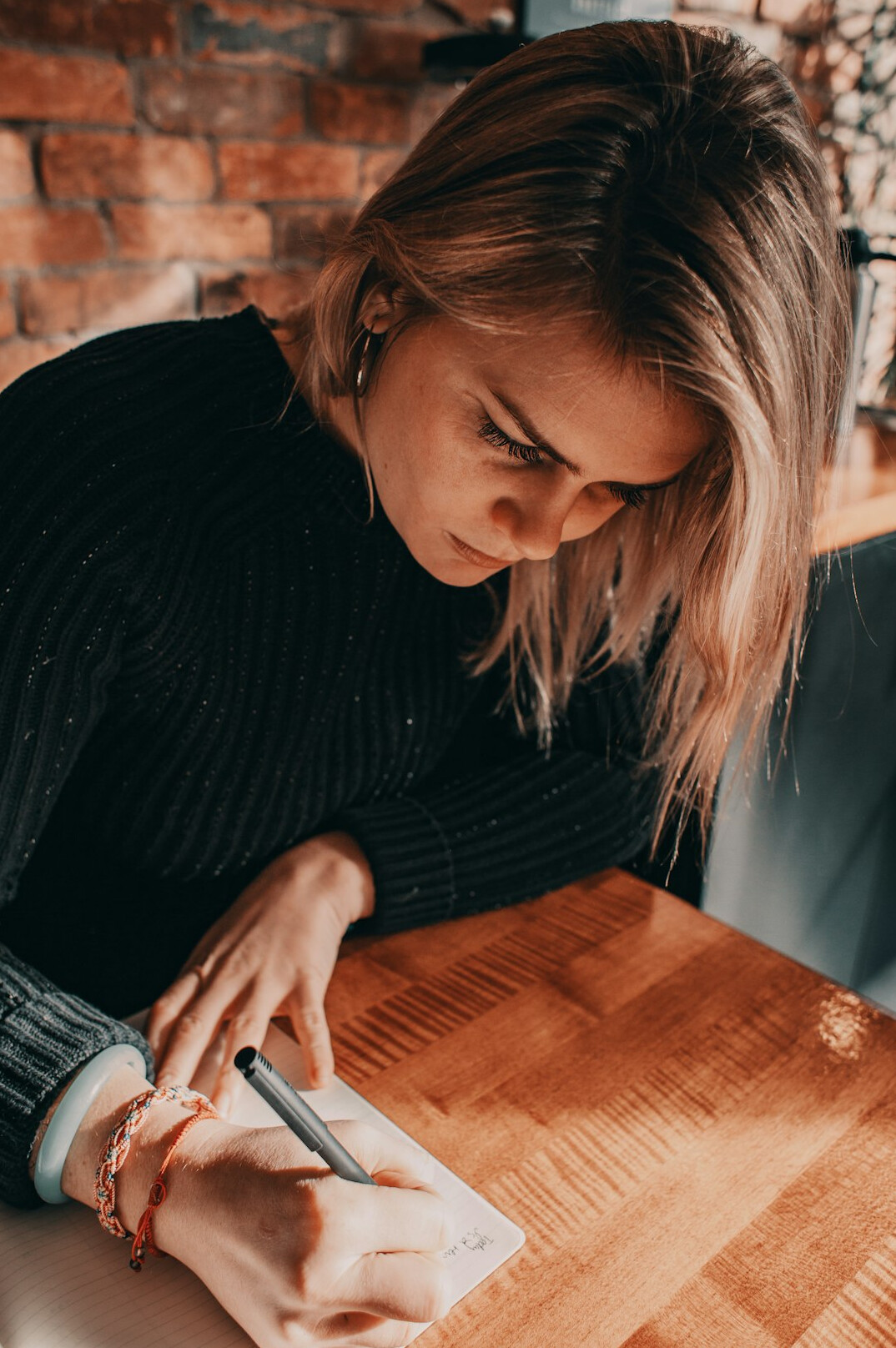 writer at desk with notes